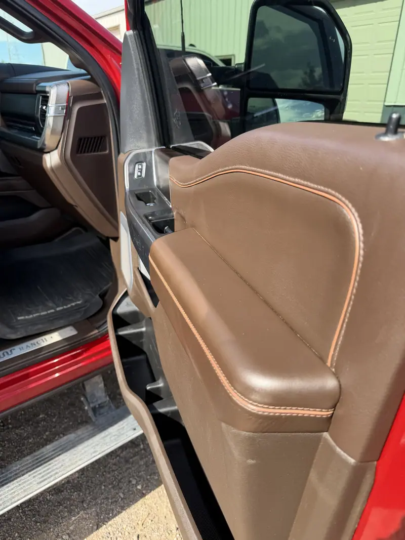 Driver door panel and sill of a Ford pickup after detailing