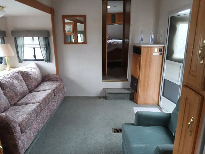 RV living area after interior detailing: couch, carpet and cabinets cleaned